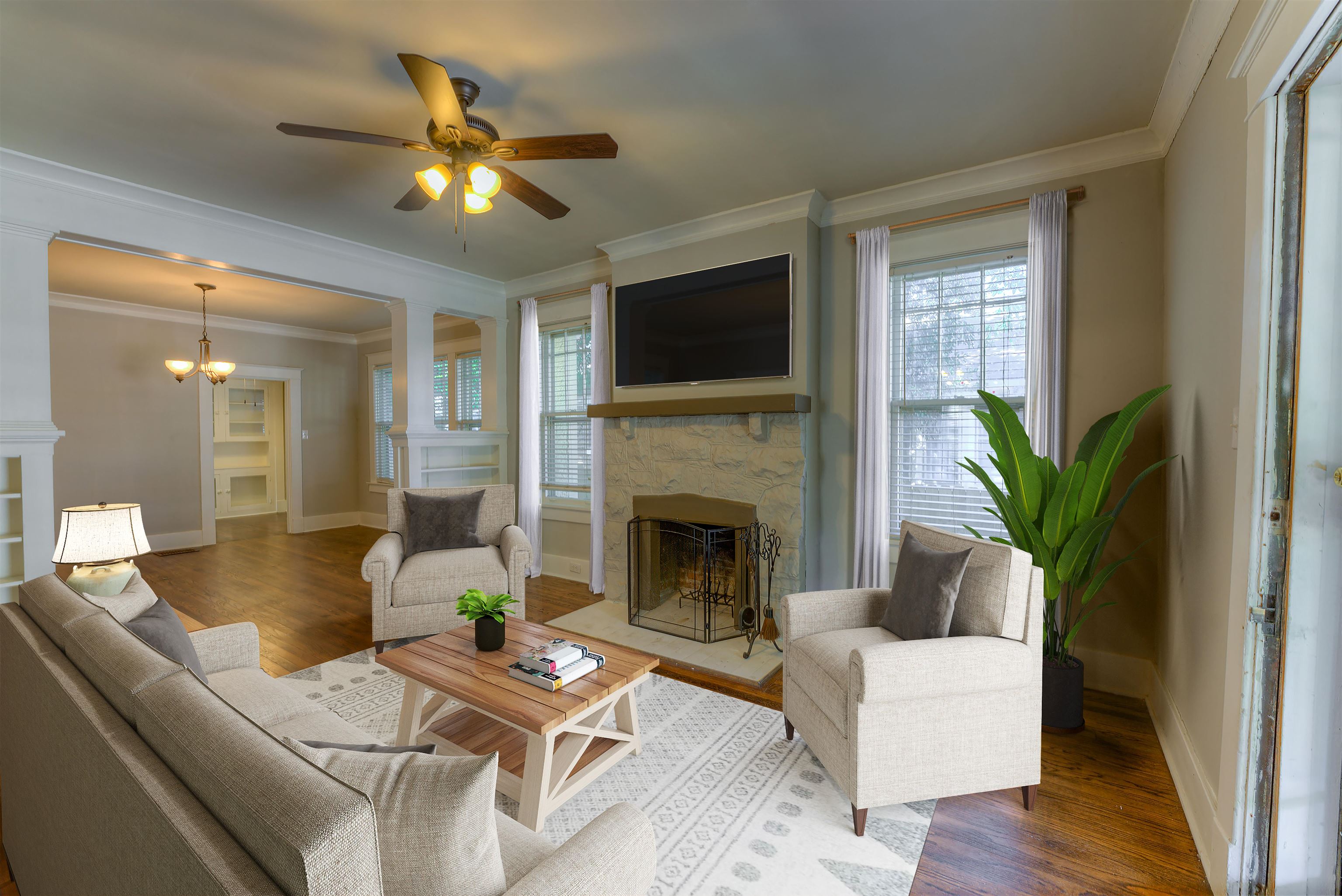 191 Lemaster Street Memphis, TN 38104 - Photo 4 of 27 Living room with a fireplace, crown molding, wood finished floors, and healthy amount of natural light