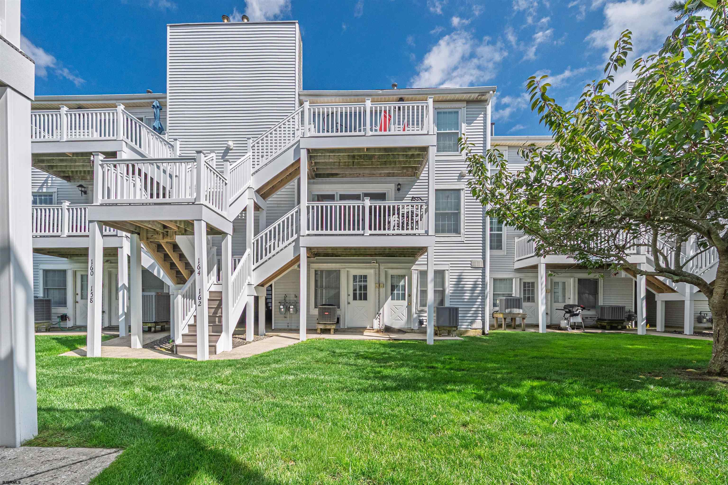 162 39th Street South, Unit 162 Brigantine, NJ 08203 - Photo 14 of 16 front view of a house with a yard