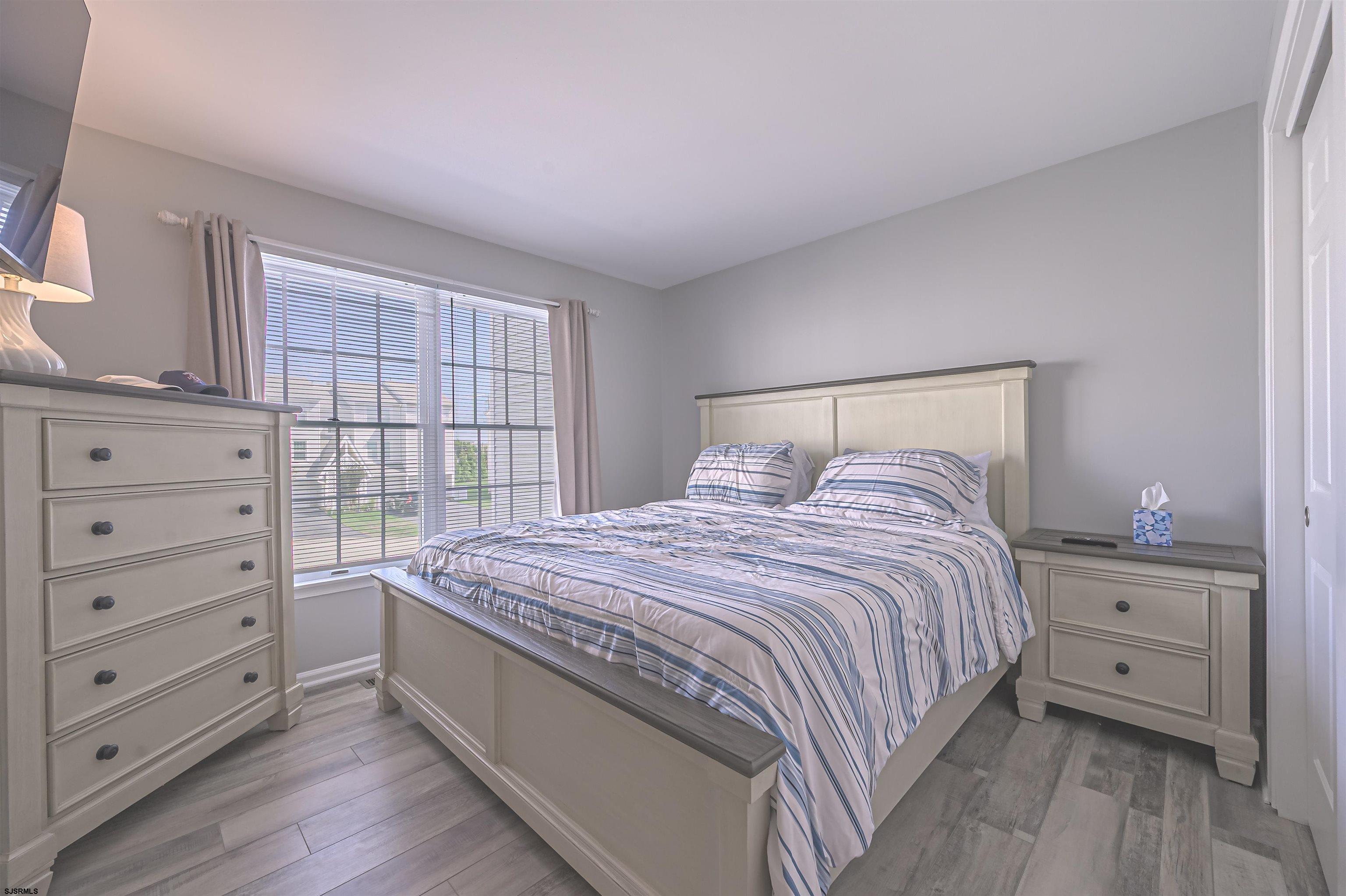 162 39th Street South, Unit 162 Brigantine, NJ 08203 - Photo 7 of 16 a bedroom with a bed and a window