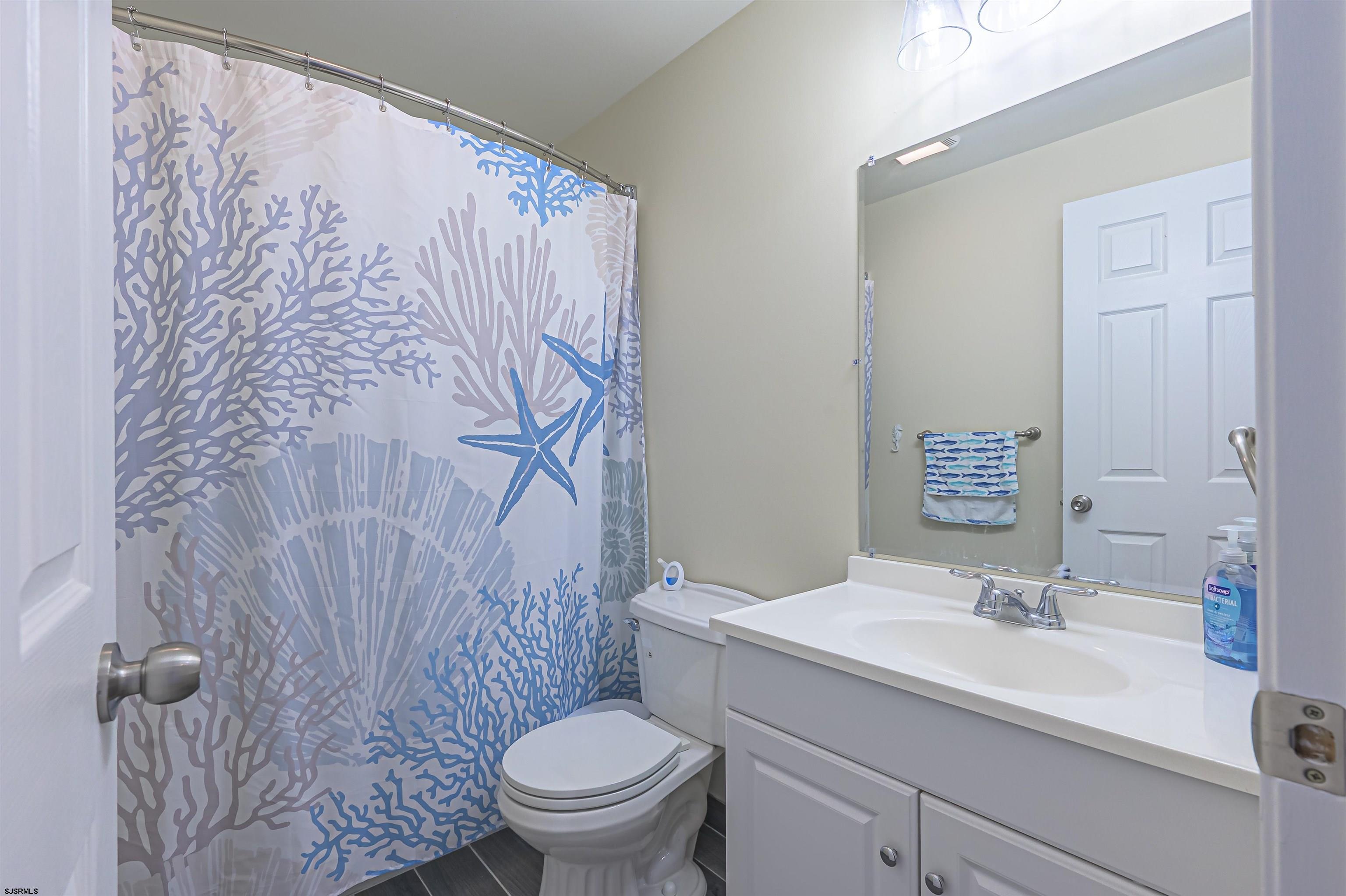 162 39th Street South, Unit 162 Brigantine, NJ 08203 - Photo 8 of 16 a bathroom with a sink toilet and shower