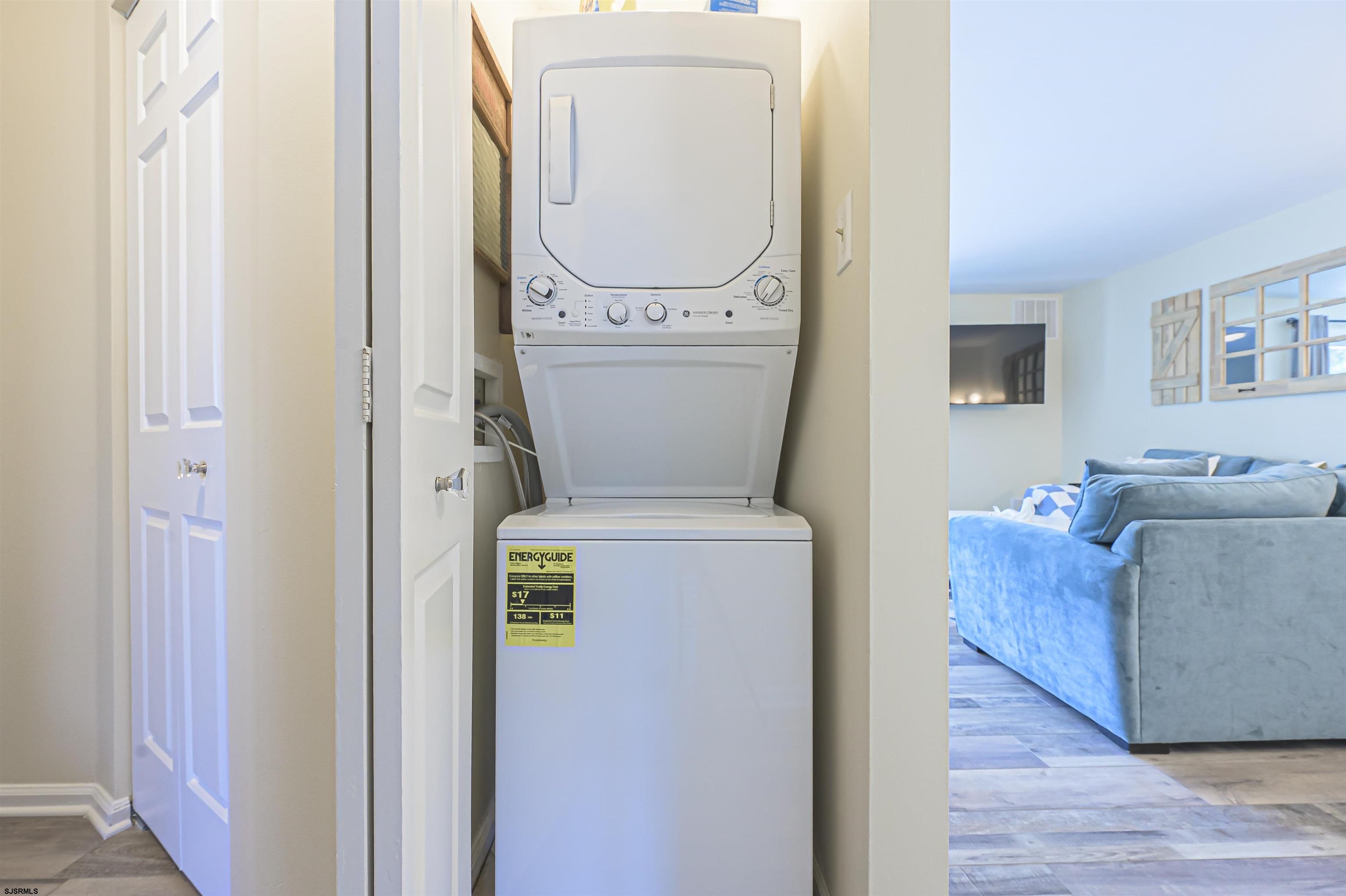 162 39th Street South, Unit 162 Brigantine, NJ 08203 - Photo 10 of 16 a living room with furniture and a washer dryer