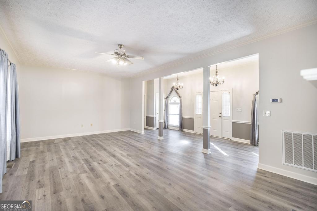 3077 River Ridge Drive Macon, GA 31204 - Photo 11 of 35 wooden floor in an empty room with a window