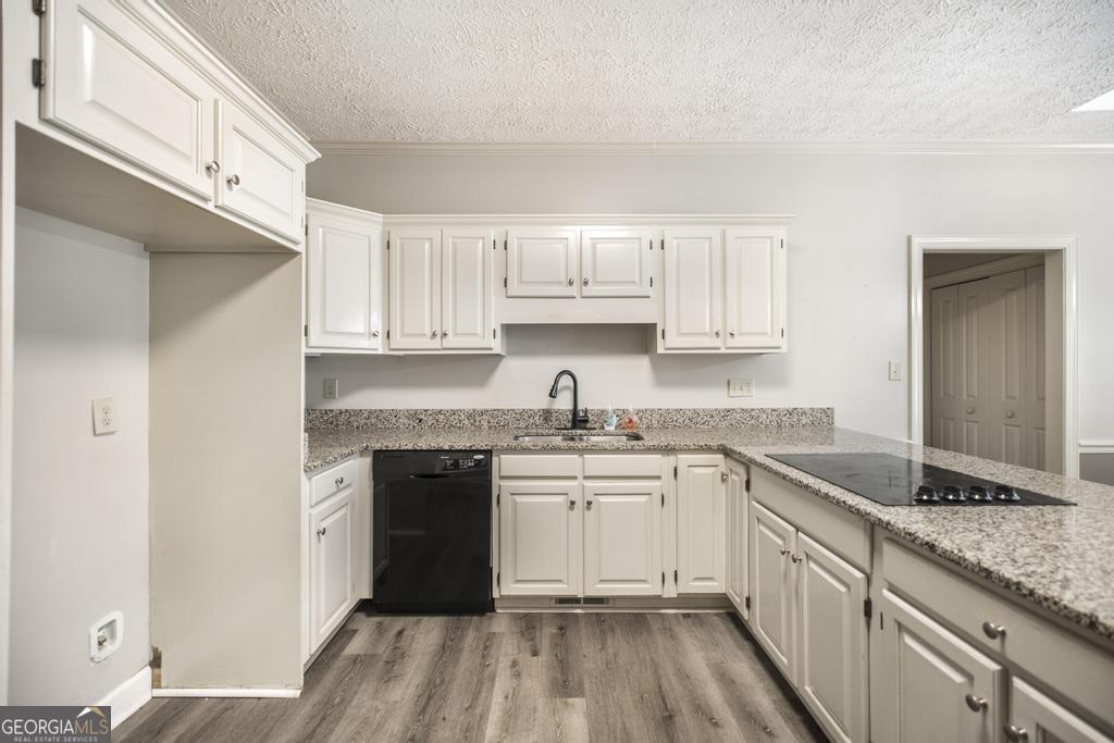 3077 River Ridge Drive Macon, GA 31204 - Photo 15 of 35 a kitchen with granite countertop cabinets stainless steel appliances a sink and a counter top space