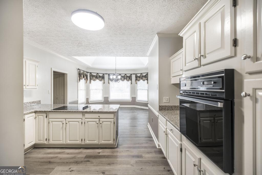 3077 River Ridge Drive Macon, GA 31204 - Photo 17 of 35 a large kitchen with a stove top oven
