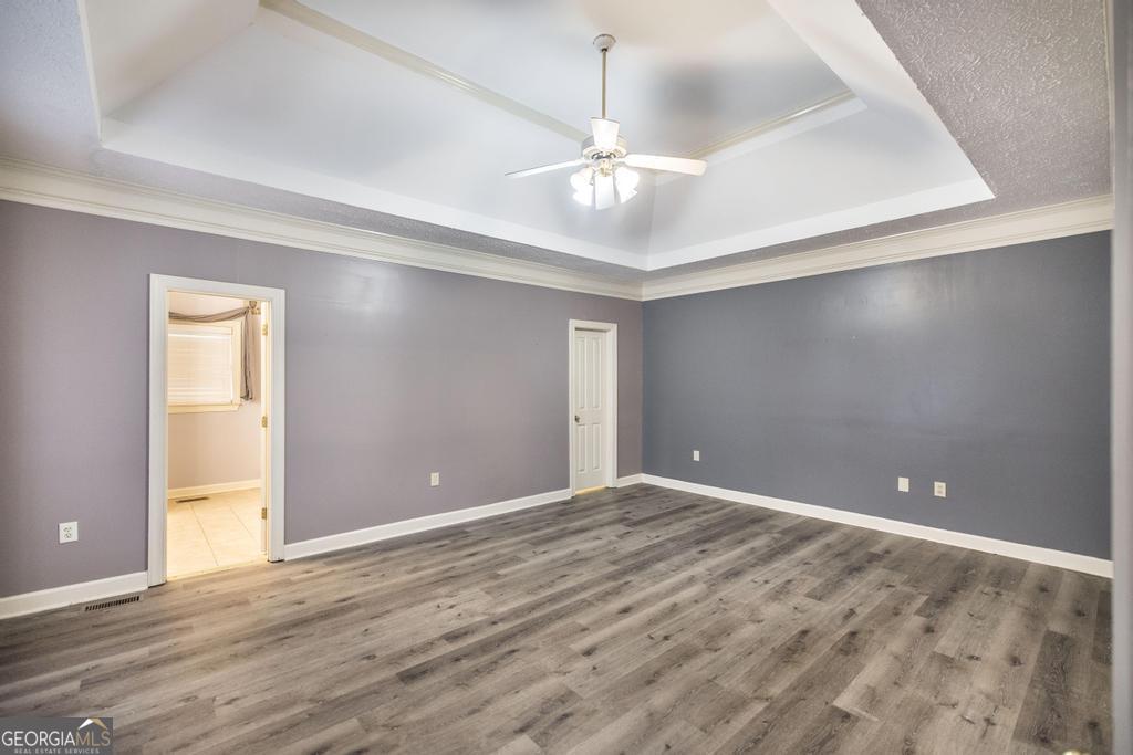 3077 River Ridge Drive Macon, GA 31204 - Photo 20 of 35 a view of an empty room with window and wooden floor
