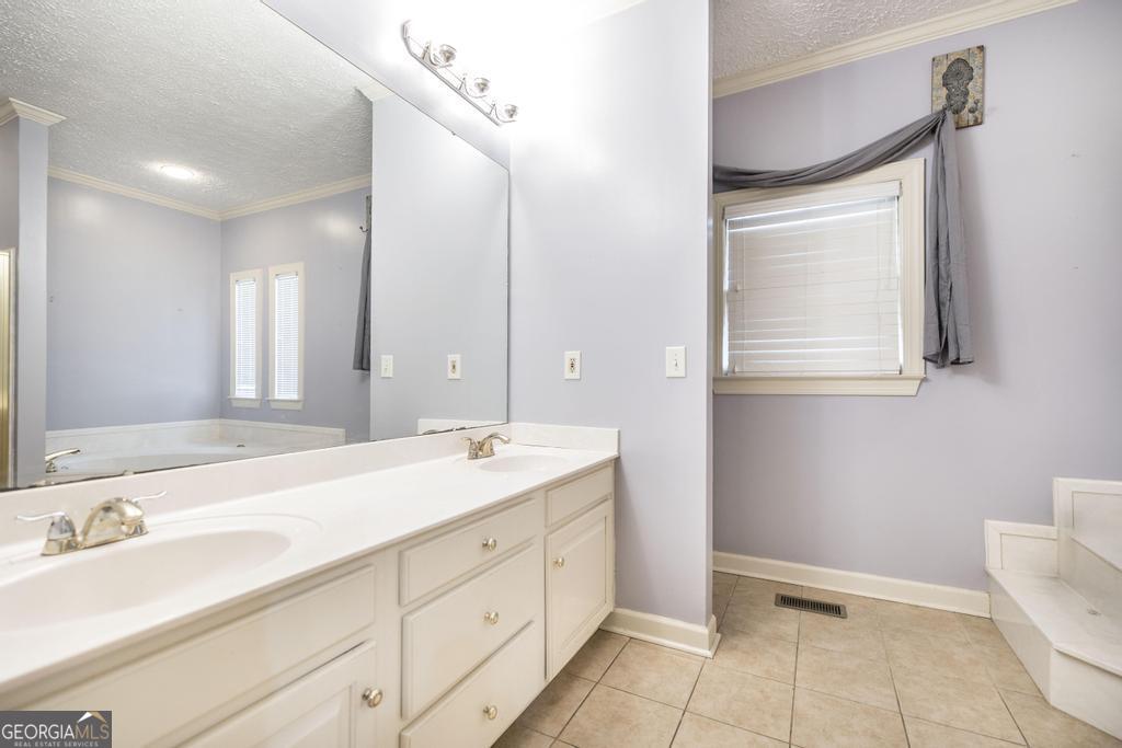 3077 River Ridge Drive Macon, GA 31204 - Photo 22 of 35 a spacious bathroom with a double vanity sink mirror and