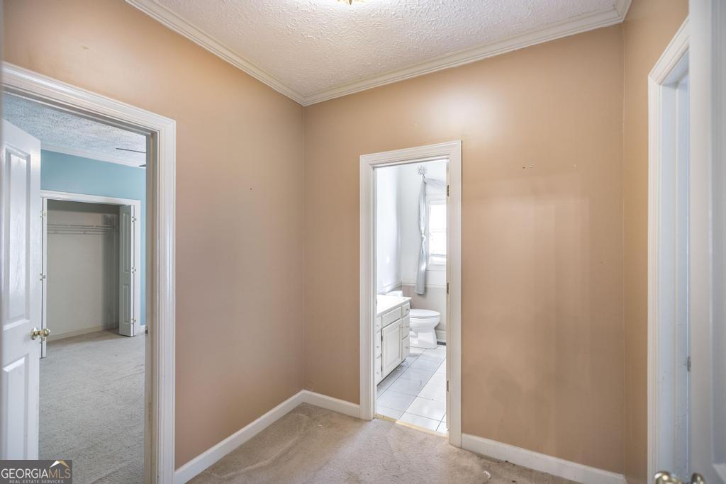 3077 River Ridge Drive Macon, GA 31204 - Photo 25 of 35 a view of a bathroom from a hallway