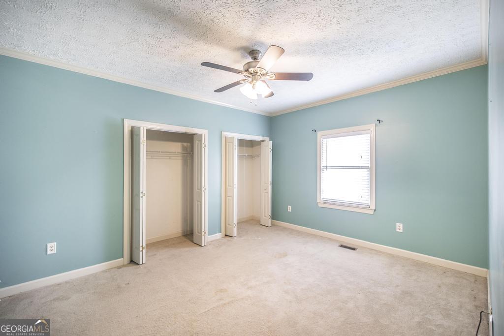 3077 River Ridge Drive Macon, GA 31204 - Photo 29 of 35 an empty room with fan and windows