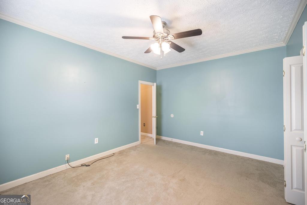 3077 River Ridge Drive Macon, GA 31204 - Photo 30 of 35 an empty room and chandelier fan