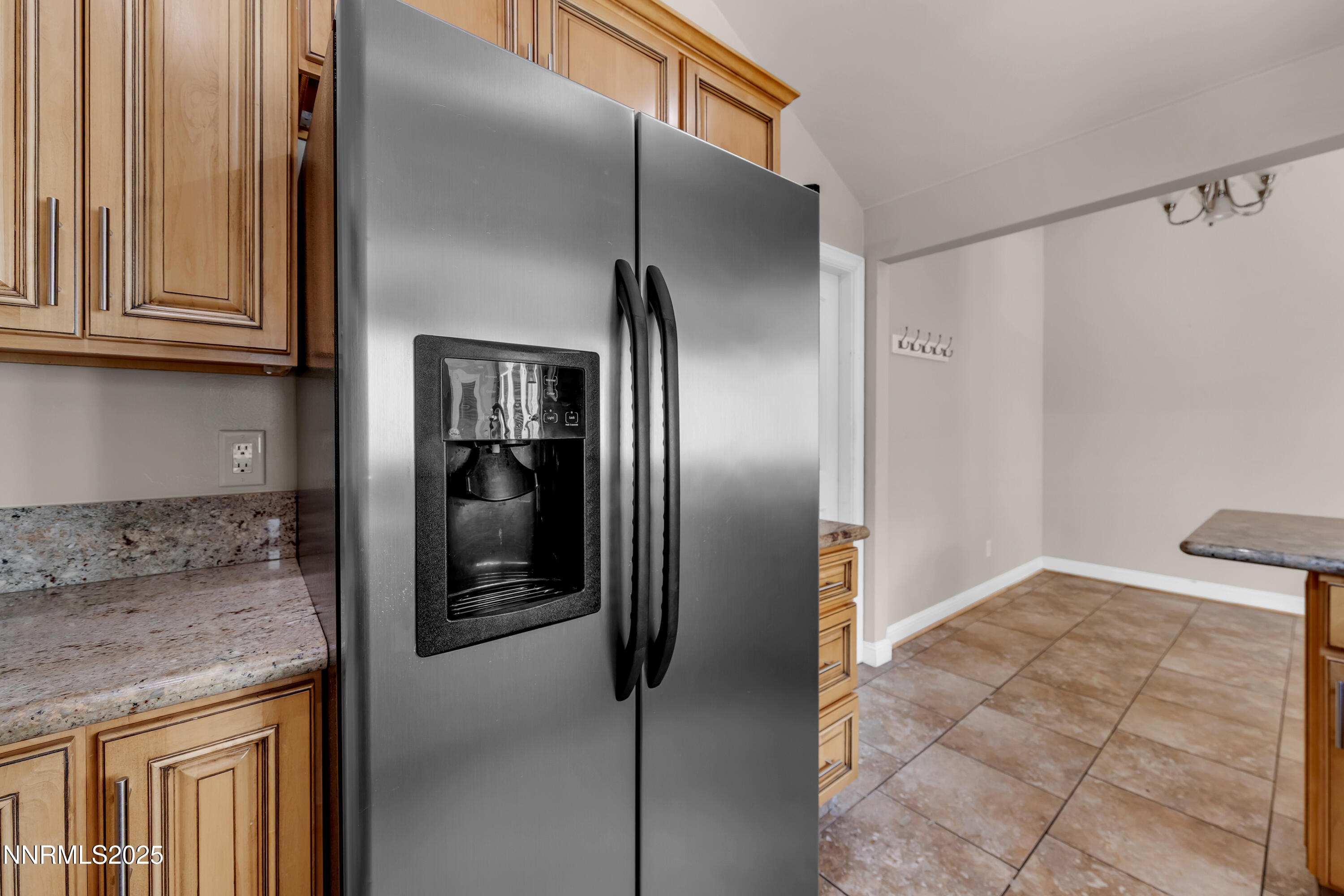 1220 Conway Lane Reno, NV 89503 - Photo 23 of 30 a view of a refrigerator in kitchen and an empty room