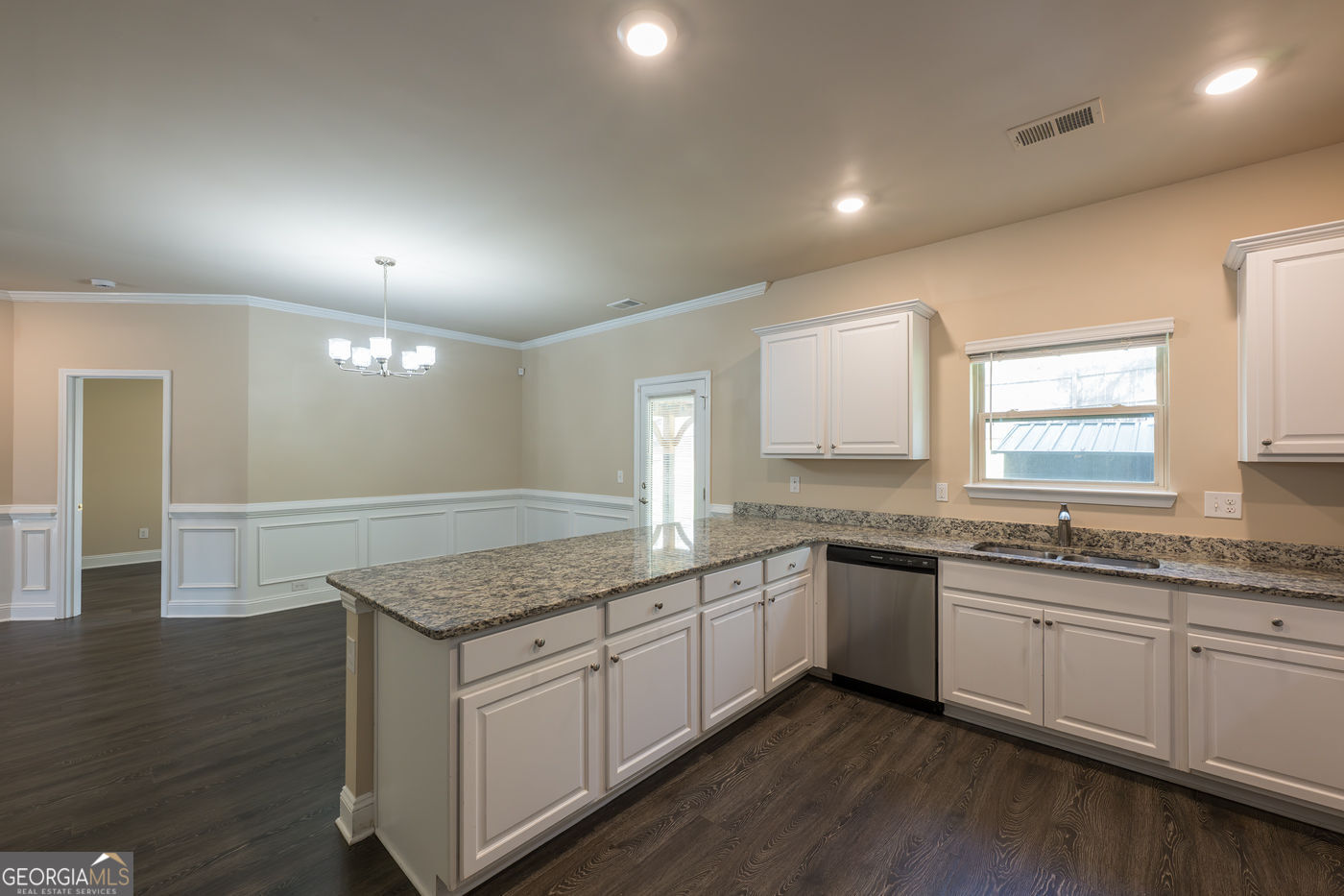 12172 Flannery Lane Hampton, GA 30228 - Photo 12 of 31 a kitchen with granite countertop sink stove and cabinets