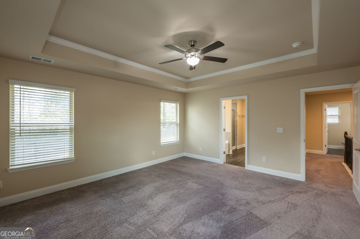 12172 Flannery Lane Hampton, GA 30228 - Photo 18 of 31 a view of a big room with windows and chandelier fan