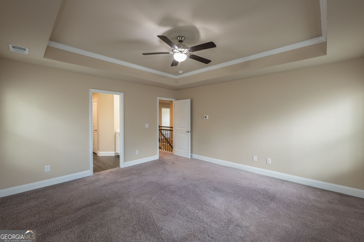 12172 Flannery Lane Hampton, GA 30228 - Photo 19 of 31 a view of an empty room with a ceiling fan