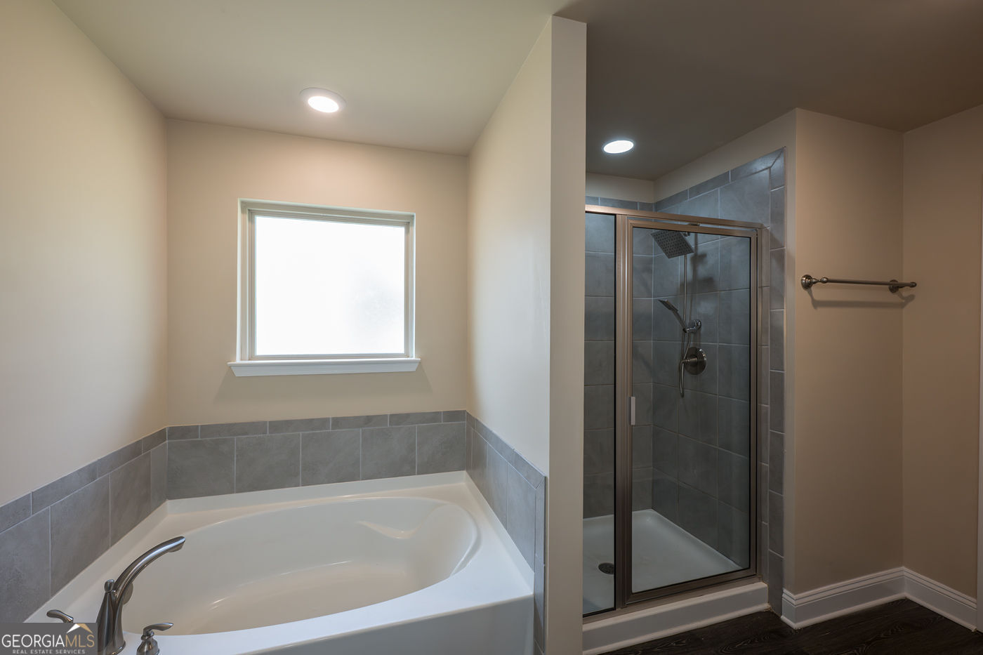 12172 Flannery Lane Hampton, GA 30228 - Photo 22 of 31 a bathroom with a bathtub and shower