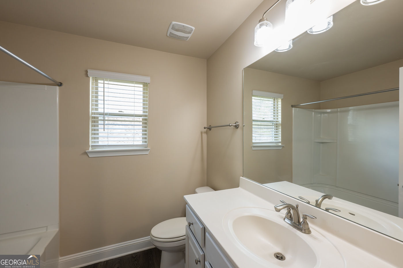 12172 Flannery Lane Hampton, GA 30228 - Photo 23 of 31 a bathroom with a sink toilet and vanity