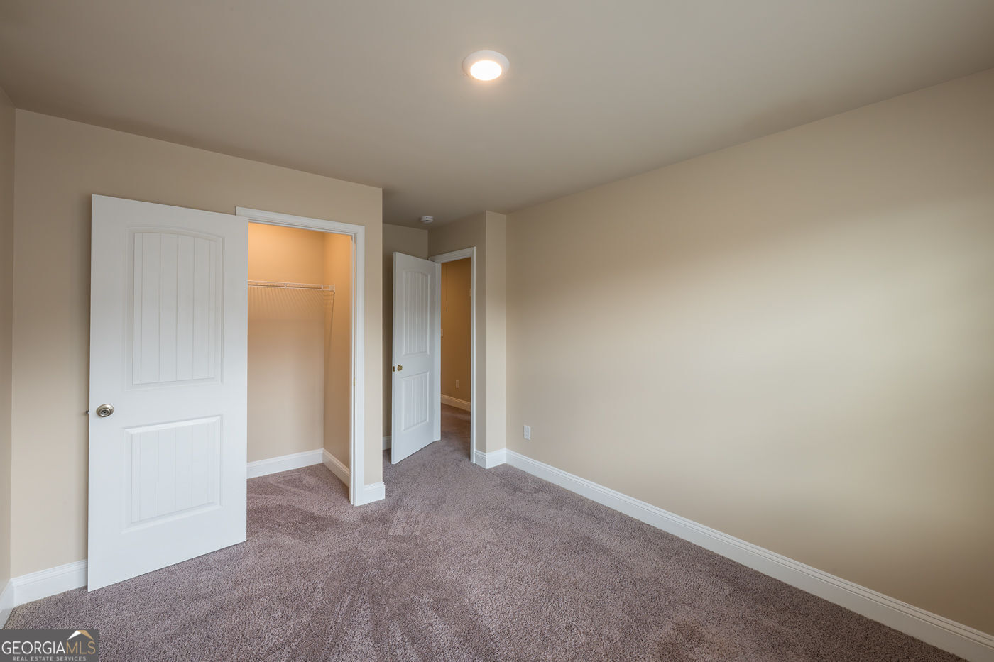 12172 Flannery Lane Hampton, GA 30228 - Photo 29 of 31 an empty room with closet and a bathroom