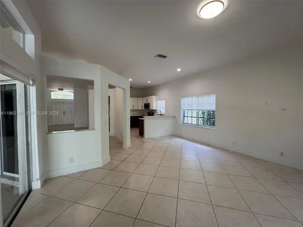 a kitchen with granite countertop a sink and stainless steel appliances