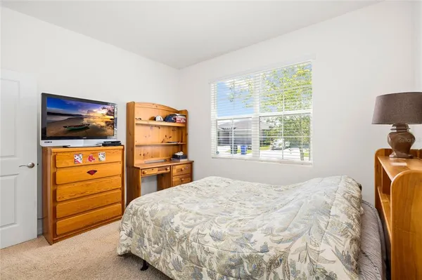 a bedroom with a bed and furniture