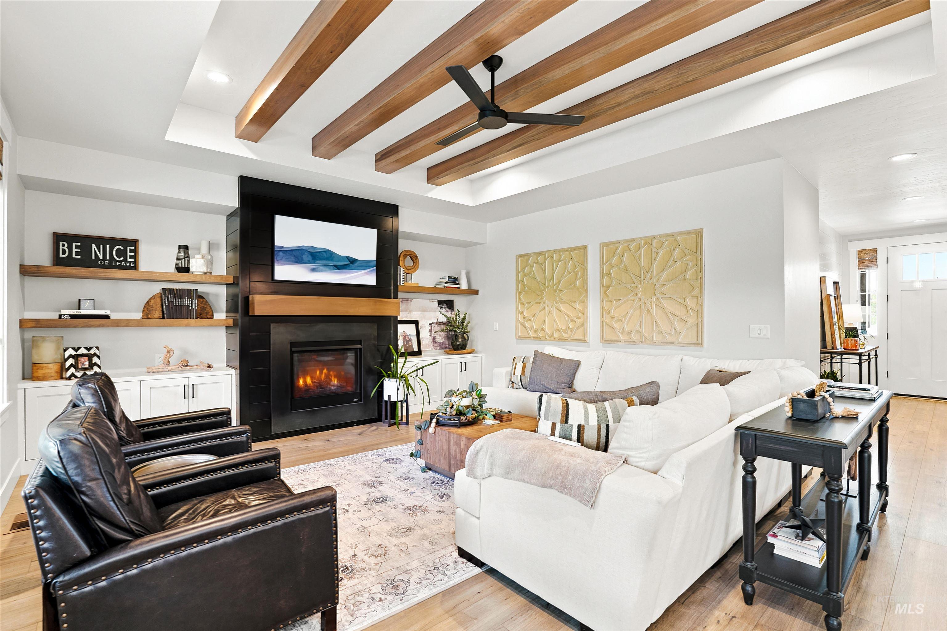 4323 West Ladle Rpds Drive Meridian, ID 83646 - Photo 13 of 49 Living area featuring wood-finish flooring and a coffered ceiling with exposed wood beams