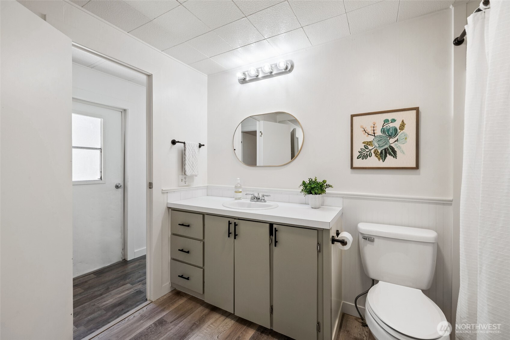 1527 East Roy Road Freeland, WA 98249 - Photo 16 of 24 a bathroom with a toilet a sink and mirror
