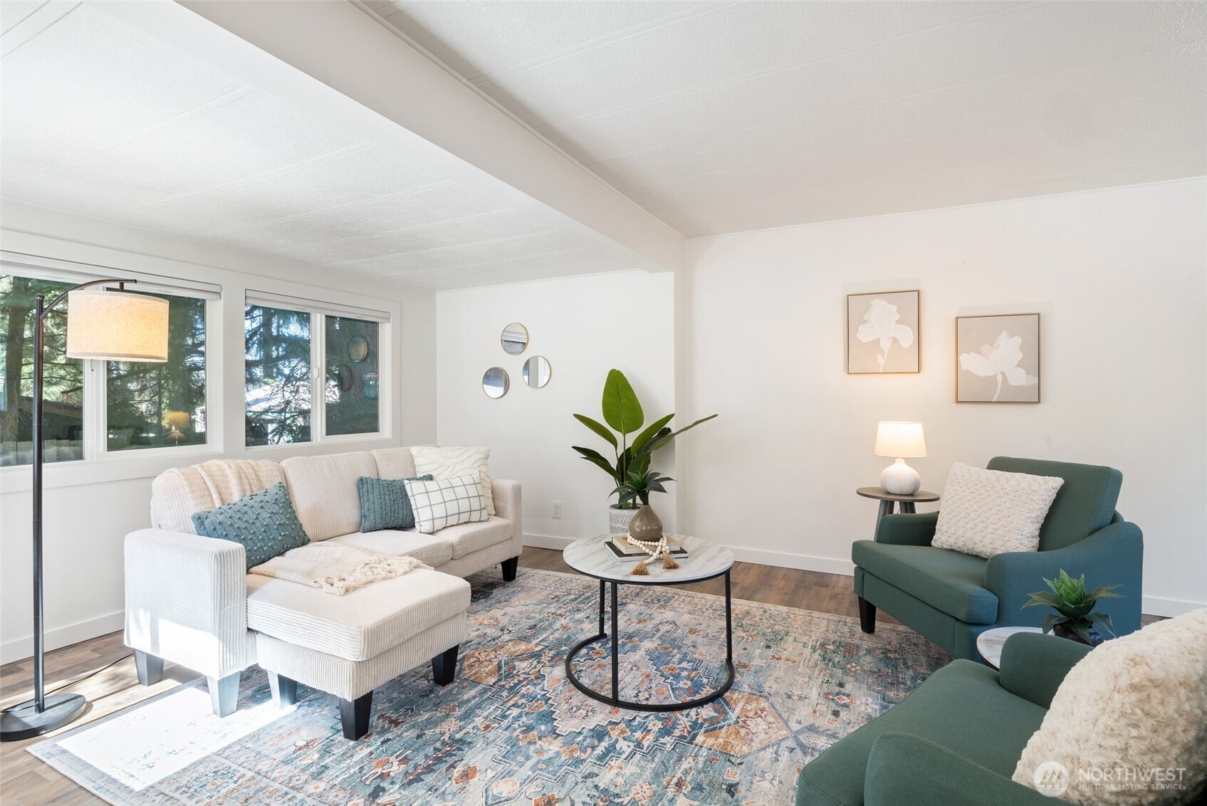 1527 East Roy Road Freeland, WA 98249 - Photo 3 of 24 a living room with furniture and a potted plant