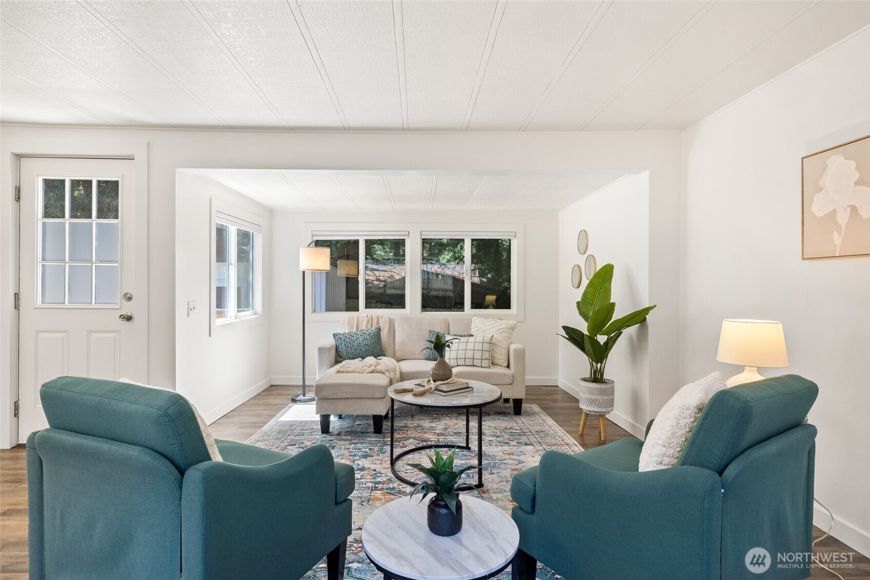 1527 East Roy Road Freeland, WA 98249 - Photo 4 of 24 a living room with furniture and a potted plant