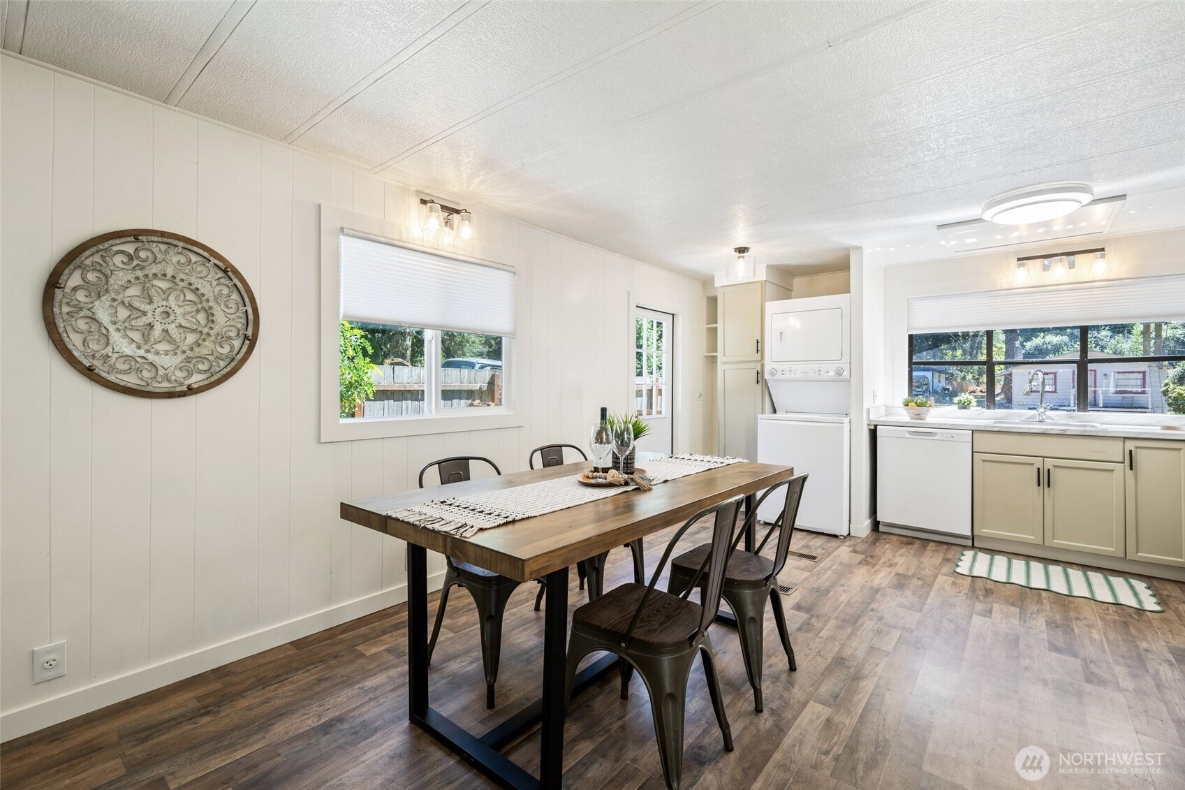 1527 East Roy Road Freeland, WA 98249 - Photo 6 of 24 a view of a dining room with furniture window and wooden floor