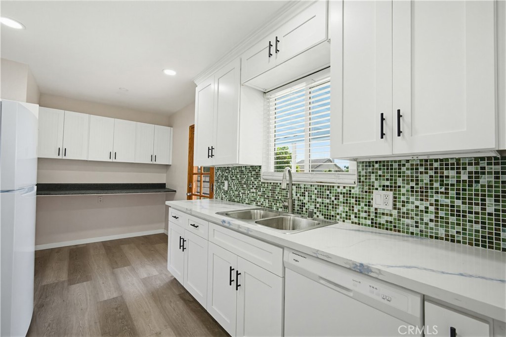 9805 Devon Street Rancho Cucamonga, CA 91730 - Photo 12 of 31 a kitchen with a sink and cabinets