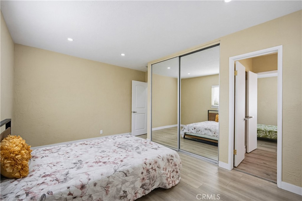 9805 Devon Street Rancho Cucamonga, CA 91730 - Photo 20 of 31 a bedroom with a bed and a walk in closet