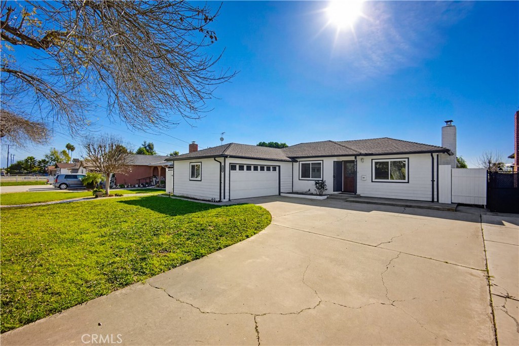 9805 Devon Street Rancho Cucamonga, CA 91730 - Photo 2 of 31 a view of a house with garden