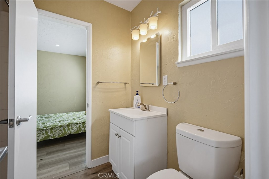 9805 Devon Street Rancho Cucamonga, CA 91730 - Photo 21 of 31 a en suite bathroom with a sink a toilet and mirror