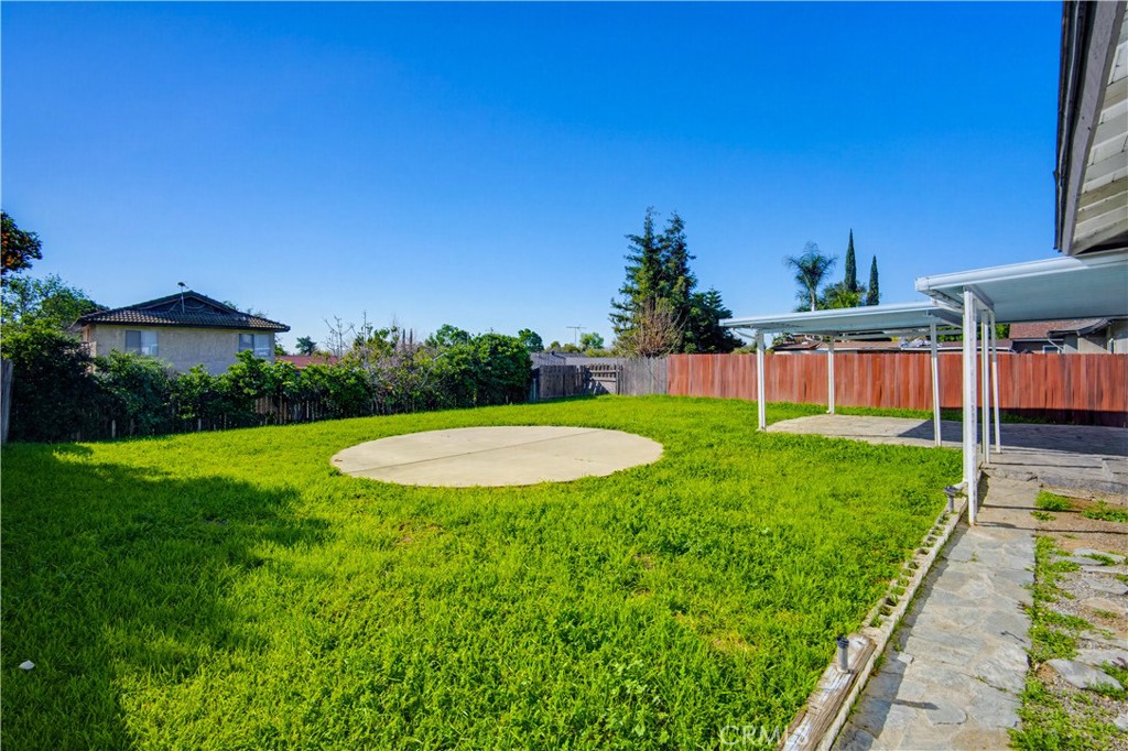 9805 Devon Street Rancho Cucamonga, CA 91730 - Photo 28 of 31 a view of a backyard with a garden