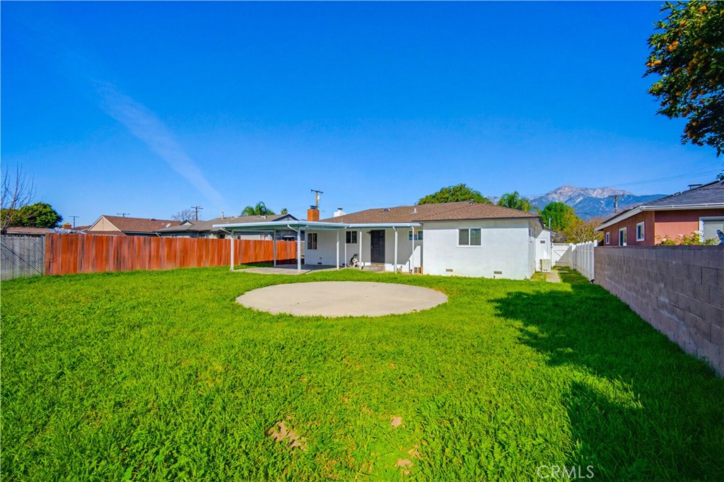 9805 Devon Street Rancho Cucamonga, CA 91730 - Photo 29 of 31 a front view of a house with a yard