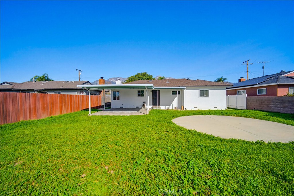 9805 Devon Street Rancho Cucamonga, CA 91730 - Photo 30 of 31 a view of a house with backyard and garden