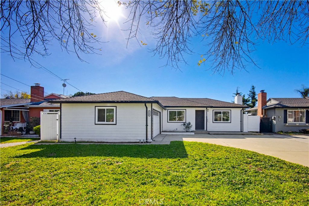 9805 Devon Street Rancho Cucamonga, CA 91730 - Photo 3 of 31 a front view of a house with swimming pool yard and outdoor seating