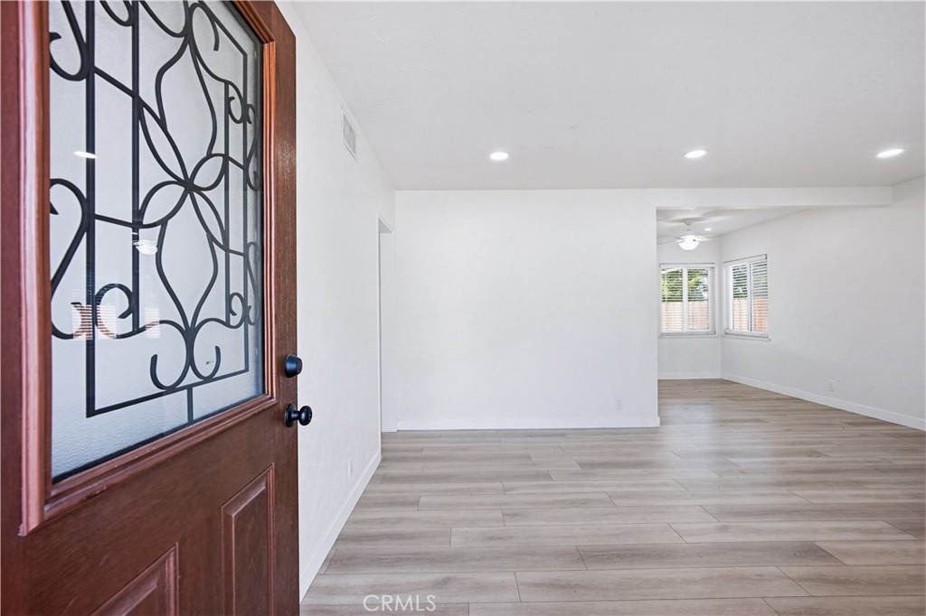 9805 Devon Street Rancho Cucamonga, CA 91730 - Photo 6 of 31 a view of an entryway with wooden floor