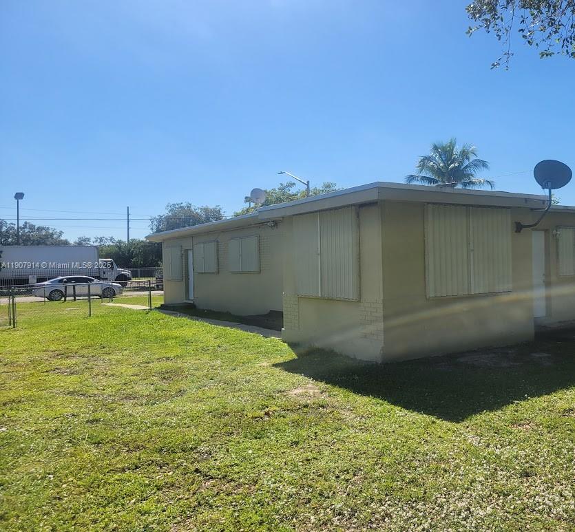751 Northwest 96th Street Miami, FL 33150 - Photo 1 of 12 a backyard of a house