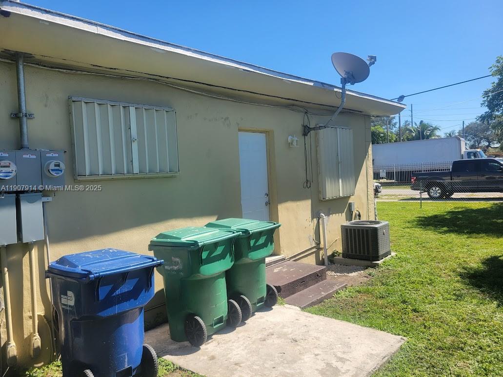 751 Northwest 96th Street Miami, FL 33150 - Photo 11 of 12 a view of a backyard with furniture and a tub