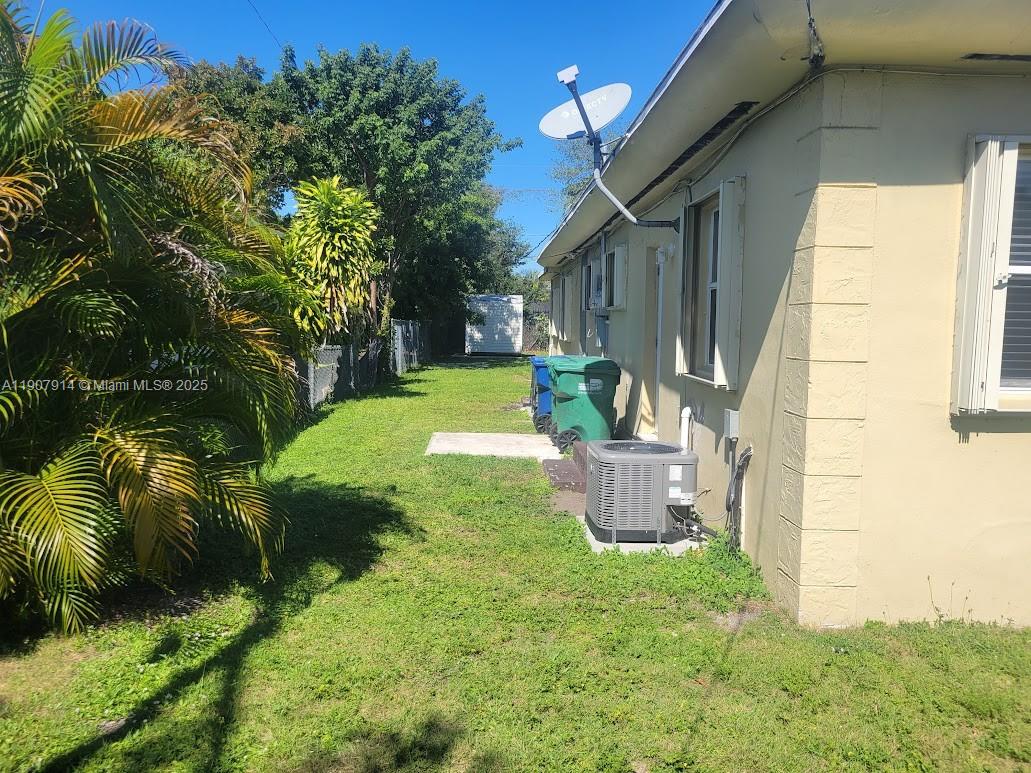 751 Northwest 96th Street Miami, FL 33150 - Photo 5 of 12 a view of a house with a backyard