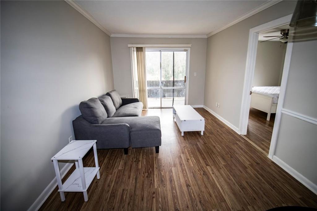 2805 Northeast Expressway Northeast, Unit C11 Atlanta, GA 30345 - Photo 5 of 14 a living room with furniture and a fireplace