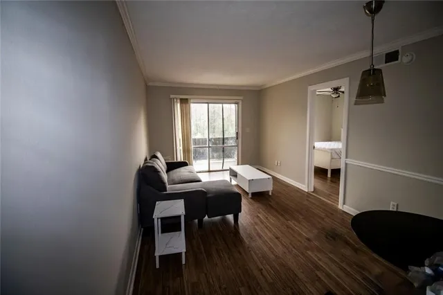 a work room with furniture and wooden floor