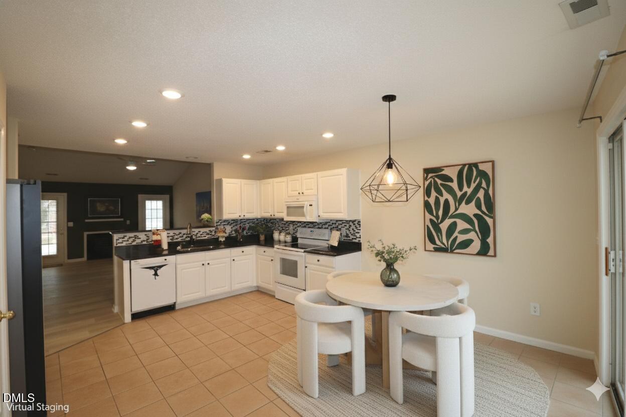 11230 Avocet Lane, Unit 102 Raleigh, NC 27617 - Photo 16 of 65 Kitchen open to living room