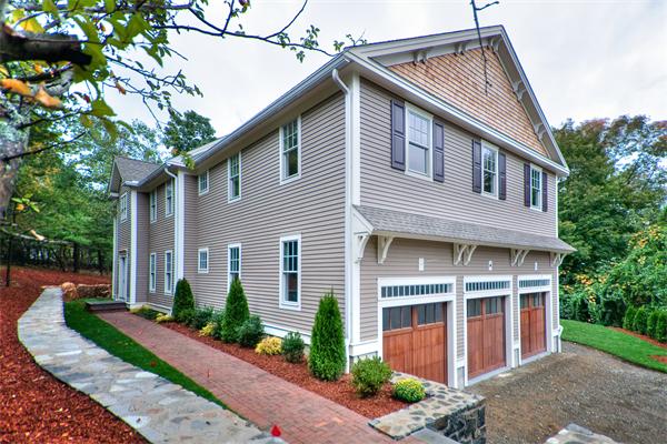 65 Paul Revere Road Lexington, MA 02421 - Photo 1 of 1 a front view of a house with a yard and potted plants