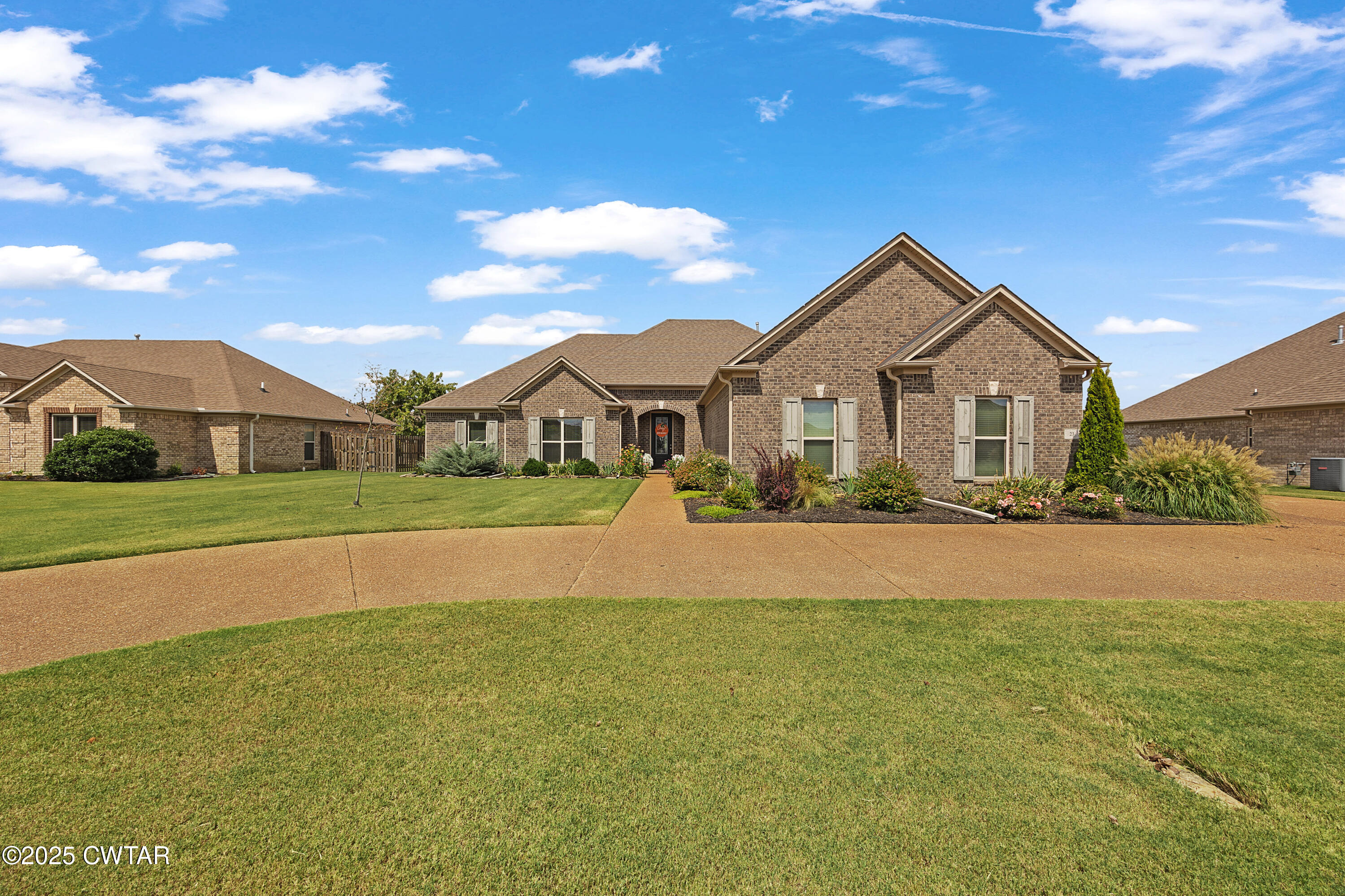 23 Shiloh Springs Jackson, TN 38305 - Photo 1 of 24 a front view of a house with a yard