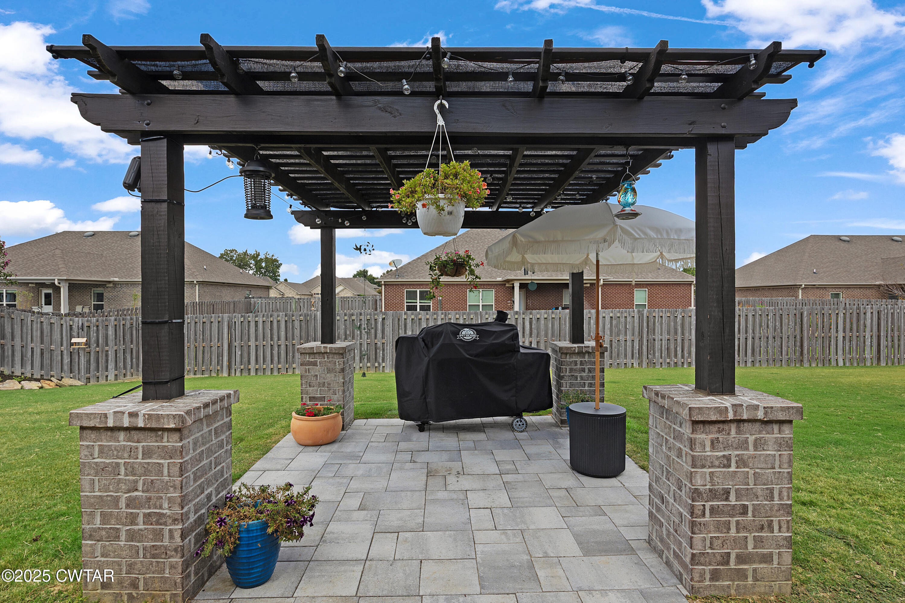 23 Shiloh Springs Jackson, TN 38305 - Photo 20 of 24 a view of a patio with table and chairs potted plants