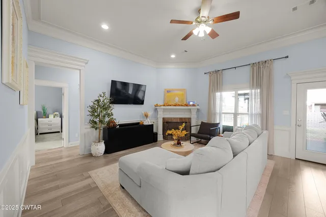 a living room with furniture fireplace and a flat screen tv