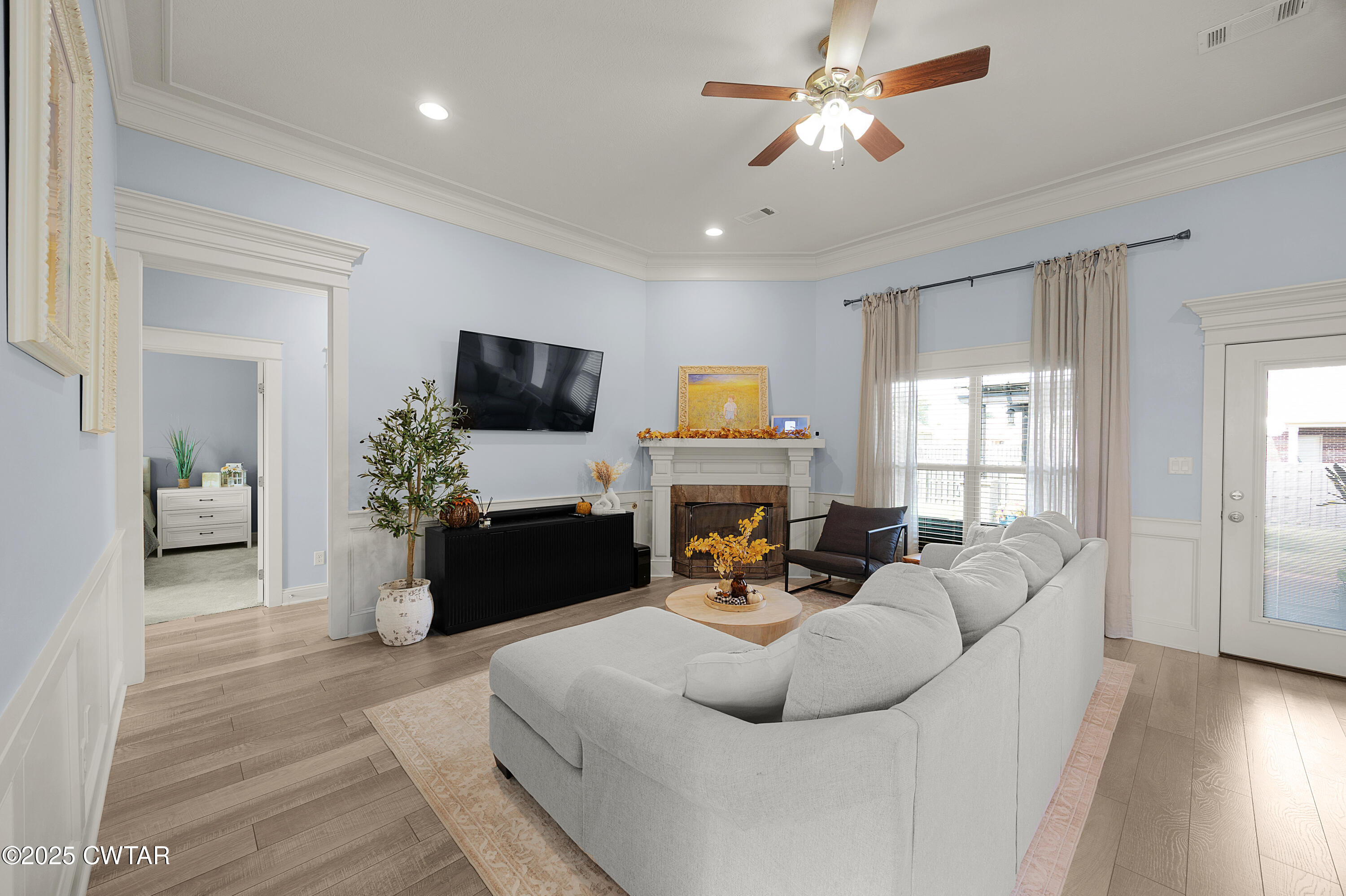 23 Shiloh Springs Jackson, TN 38305 - Photo 2 of 24 a living room with furniture fireplace and a flat screen tv