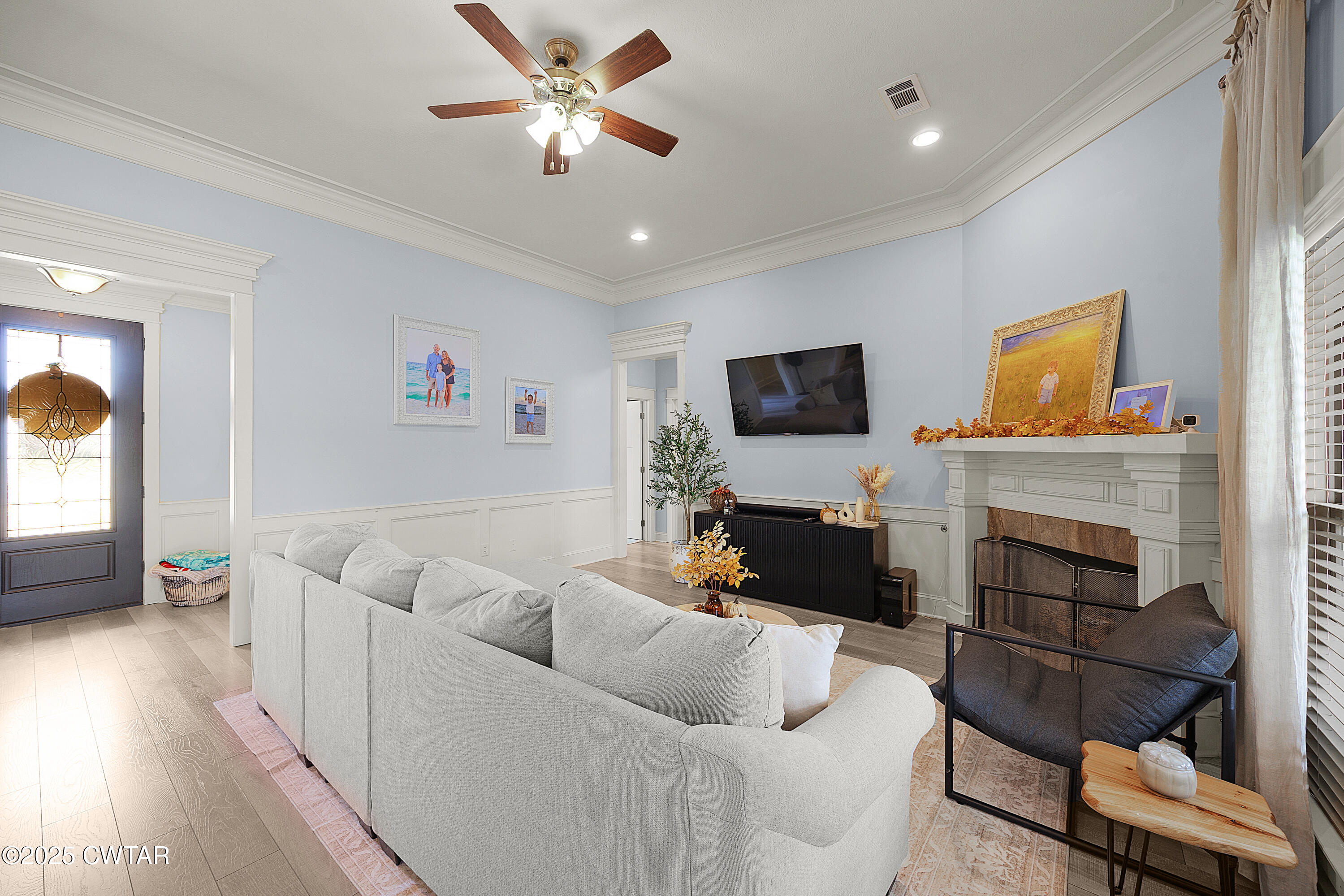 23 Shiloh Springs Jackson, TN 38305 - Photo 3 of 24 a living room with furniture a fireplace and a flat screen tv