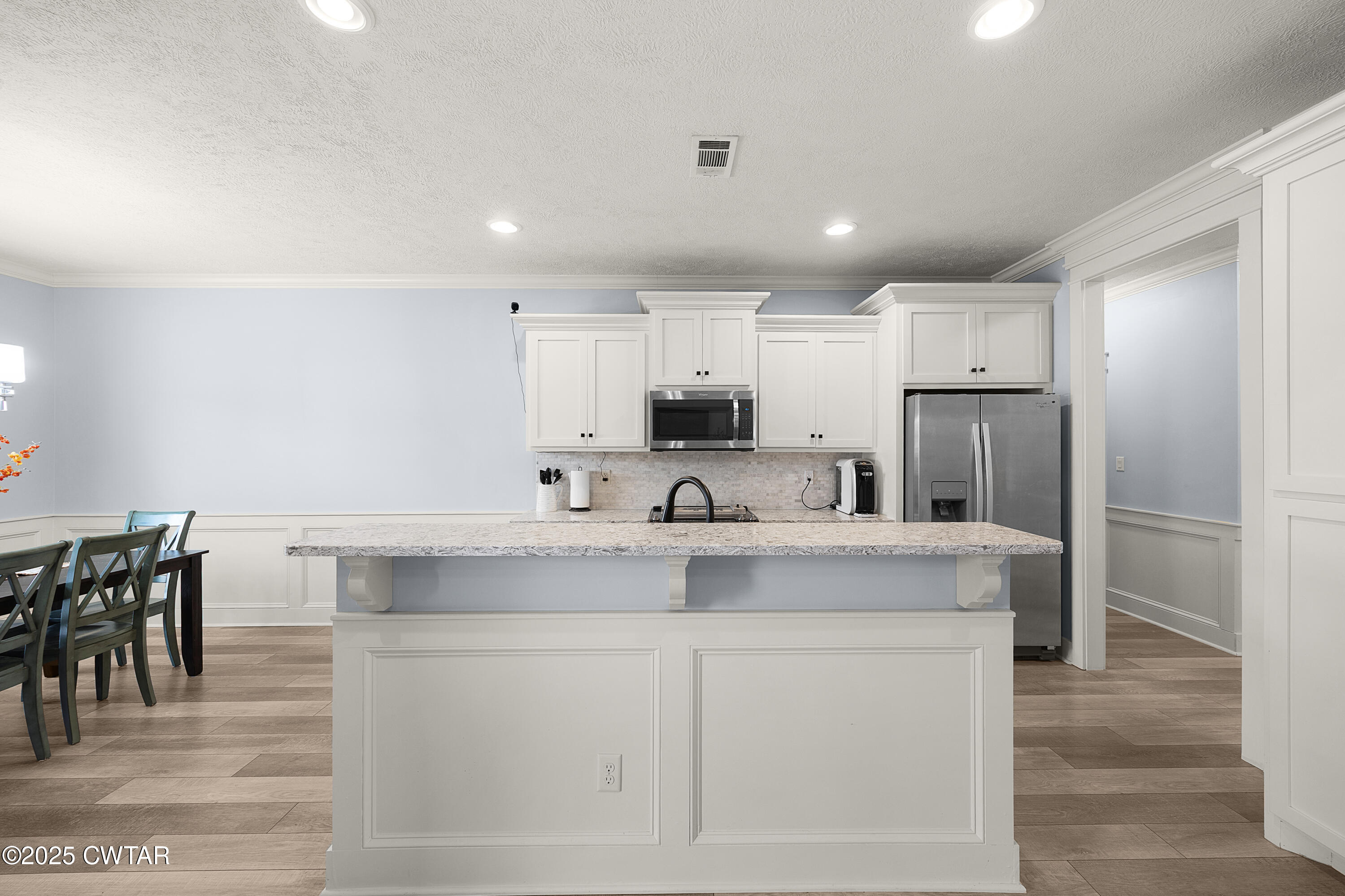 23 Shiloh Springs Jackson, TN 38305 - Photo 5 of 24 a view of kitchen with center island and stainless steel appliances