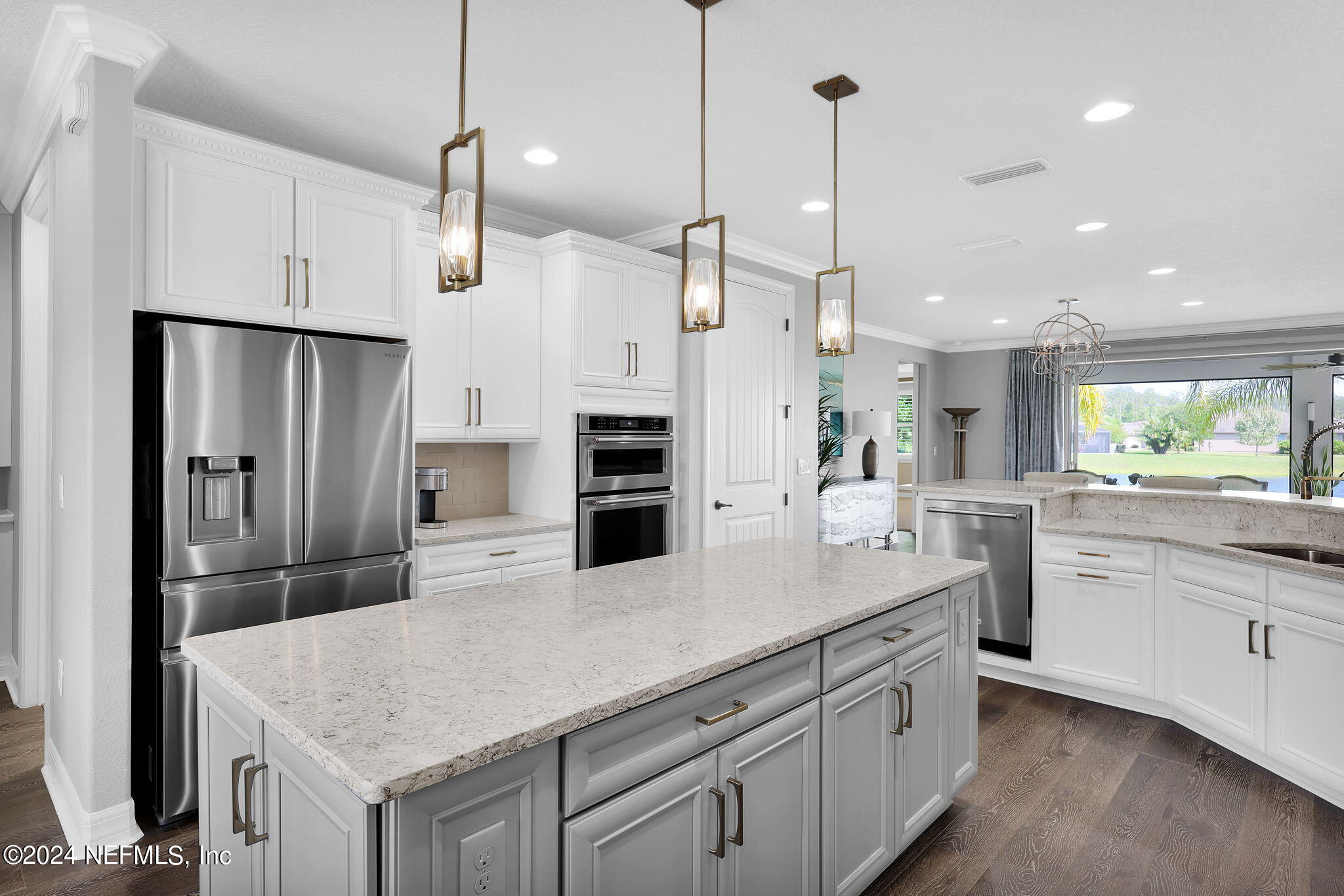 40 Tree Side Lane Ponte Vedra, FL 32081 - Photo 19 of 100 a kitchen with white cabinets and stainless steel appliances